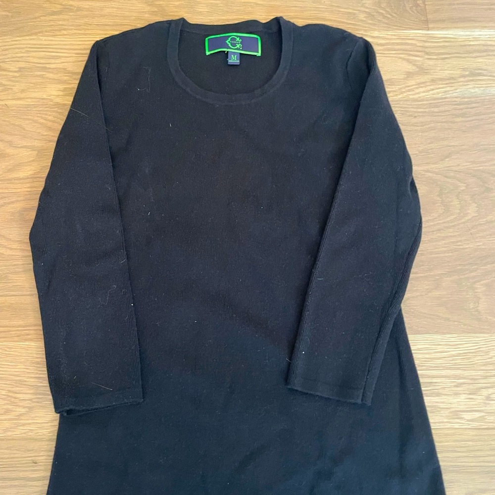 C. Wonder woman’s sweater. Size medium. Black.